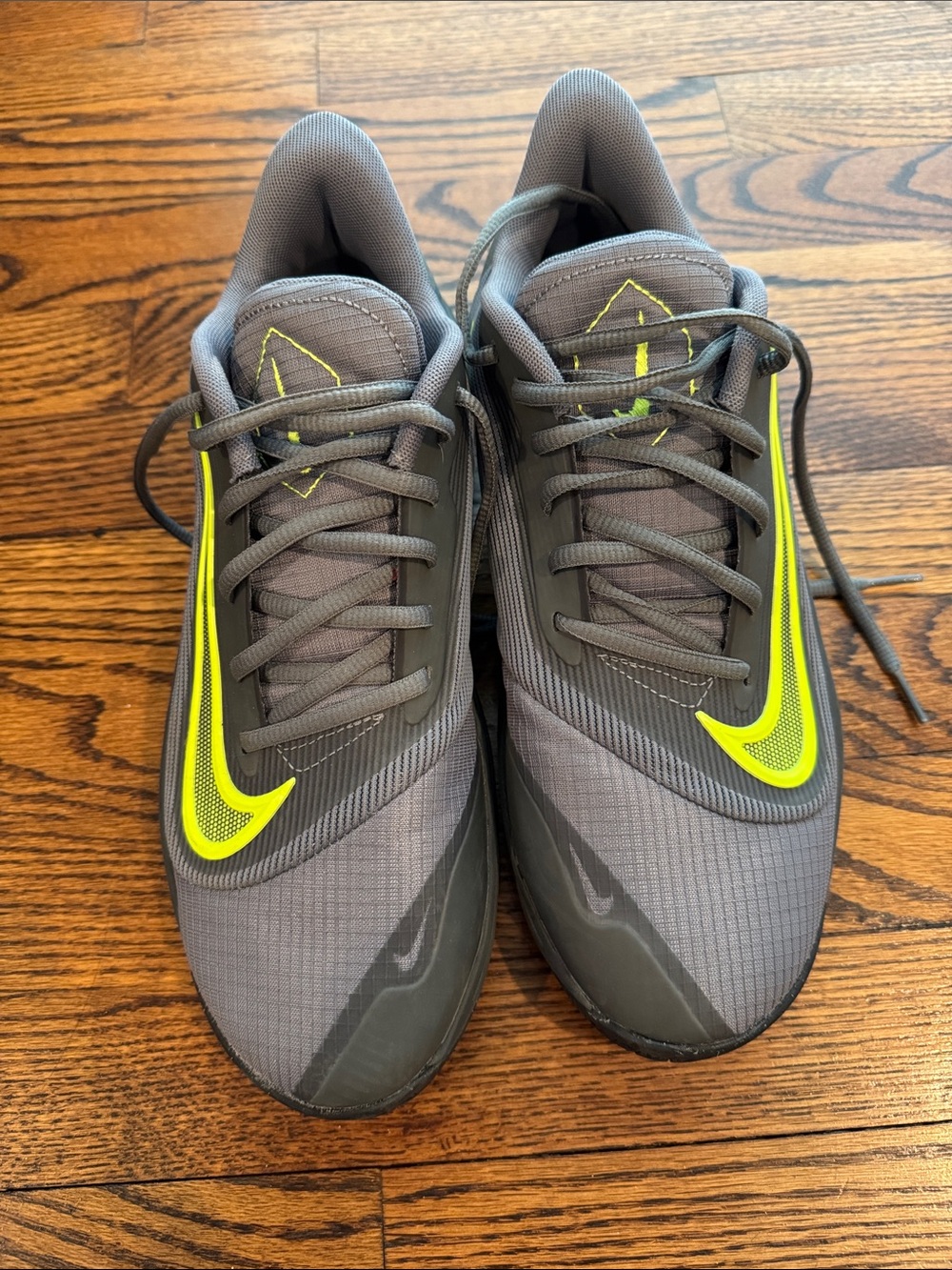 Nike Gray Sneakers with Neon Yellow Swoosh Accents basketball shoes
